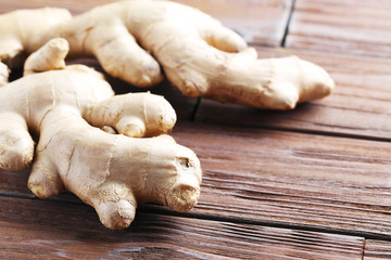 Ginger root on brown wooden table