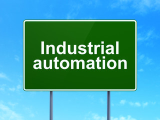 Industry concept: Industrial Automation on road sign background