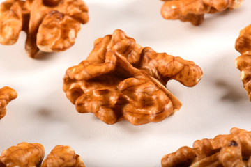 Walnuts spread on white background