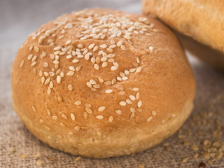 Fresh hamburger buns with sesame seeds. . Fast food.Butter cakes