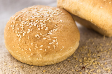 Fresh hamburger buns with sesame seeds. . Fast food.Butter cakes