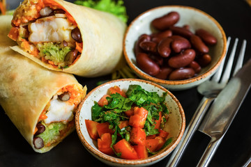 High Angle Still Life of Trio of Tex Mex Fajita Wraps Wrapped in