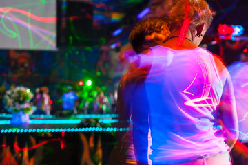 Obraz na płótnie Canvas People having fun in a disco. blur effect for an artistic touch
