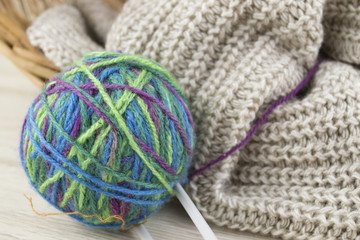 composition gray scarf, wicker baskets and thread with spokes