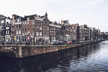 Fototapeta na wymiar Street over canal in Amsterdam