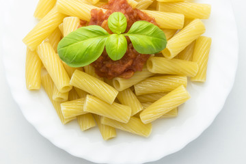 dish with macaroni and tomato sauce,isolated on white background