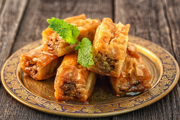 Traditional arabic dessert Baklava with honey and walnuts.