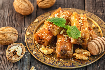 Traditional arabic dessert Baklava with honey and walnuts.