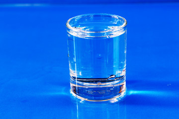 Healthy drinking water on a blue background.