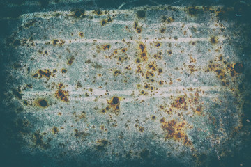 The surface of old steel sheet corrosion-damaged. Blue color. Stylized with a vignette effect.