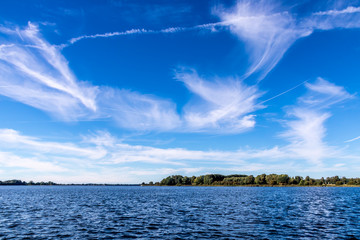 Blue sky with feather clouds 