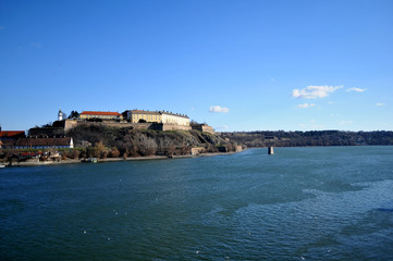 Fototapeta na wymiar The view from Varadin bridge on the international river the Danube and the fortress which is made in the 1780 year, on the coast of capital city of province Vojvodina Novi Sad, Serbia