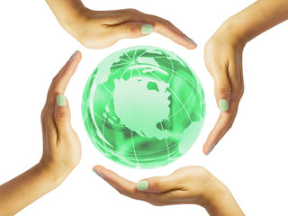 Four circular female hands around a green glass globe