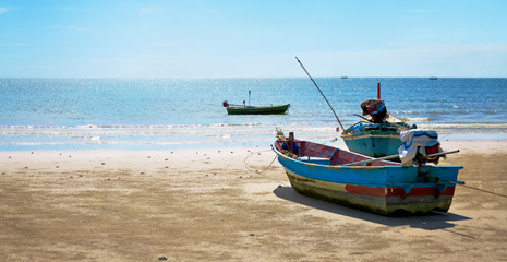 Thai fishing boats parking on the beach with negative space, Thailand