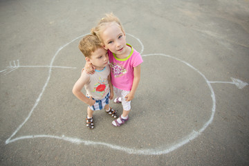 Naklejka premium Love concept. Couple of kids loving each other hugging and kissing