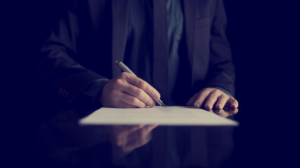 Businessman signing document or contract