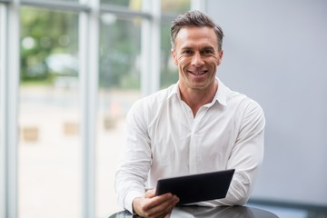 Fototapeta na wymiar Businessman holding digital tablet