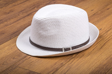 Men's Stylish Straw Hat on Wood Flooring