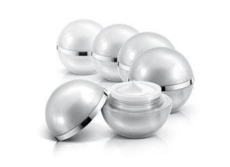Several silver sphere cosmetic jar on white background