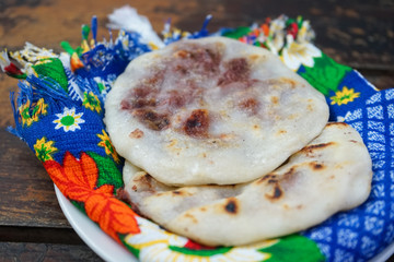 Pupusas from El Salvador, from bean to cheese on a typical Salvadoran blanket.