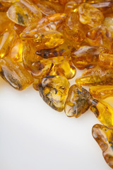Amber stones from Baltic Sea, Lithuania, on a white background. 