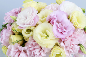 Floral arrangement with pink carnation and yellow eustoma flower