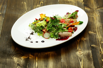 Green salad with baked meat