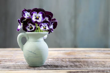 Rolgordijnen Bouquet of pansy flower in ceramic vase. © agneskantaruk