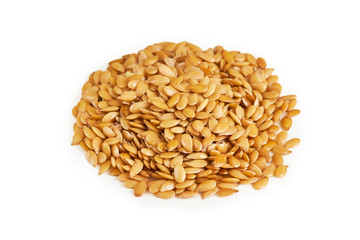 Pile of golden sesame seeds isolated on white background