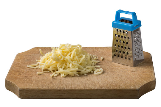 Grated cheese on wood with one little grater isolated on white