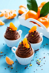 Chocolate cupcakes with orange and chocolate.