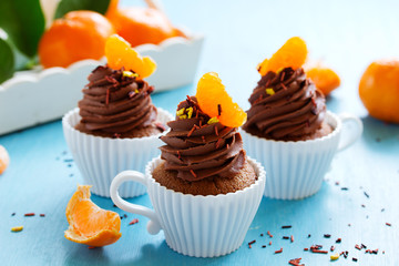 Chocolate cupcakes with orange and chocolate.