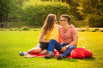 Couple with big heart on picnic