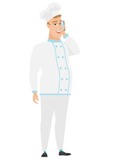 Chef cook talking on a mobile phone.