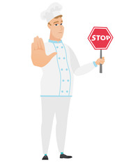 Caucasian chef cook holding stop road sign.