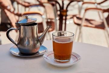 Traditional Moroccan mint tea in a cafe of Marrakech, Morocco