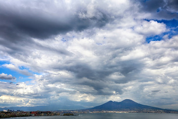 View of a mountain landscape and the sea horizon under the storm clouds