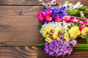 Obraz na płótnie Canvas Fresh hyacinth flowers on wooden background. Beautiful idea for greeting cards for Valentine's day, March 8 and mother's day. Free space