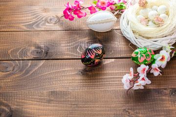Fototapeta premium Beautiful Easter eggs with flowers hyacinths on the wooden background