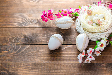 Beautiful Easter eggs with flowers hyacinths on the wooden background