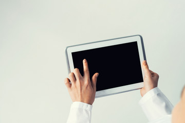 Close of female doctor hands working with tablet pc computer