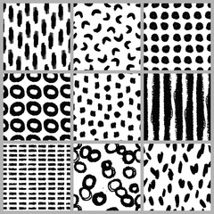 Set of nine hand drawn seamless patterns in black and white.