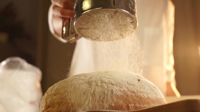 Pouring a flour to bread in slow motion
