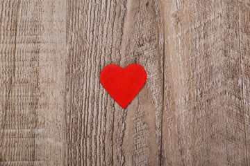 Red heart on wood rustic background. Concept for romantic love. Valentines day design. Wooden grunge board.