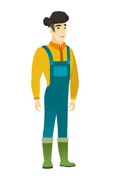 Young asian happy farmer in coveralls.