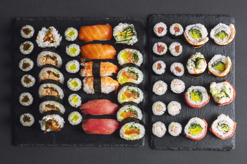 Big sushi set served on a black stone