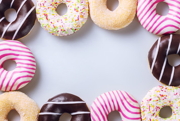 Colorful donuts composition on a white background
