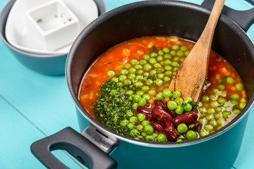Cooking Minestrone Soup On Kitchen Table