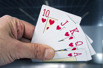 closeup of the hand with the cards of poker