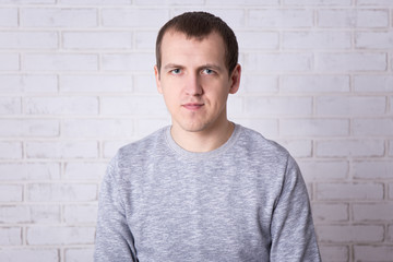 portrait of young man over white wall